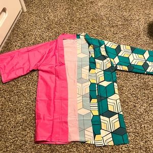 It is a short sleeve flannel. Half pink, half multicolored. medium or large